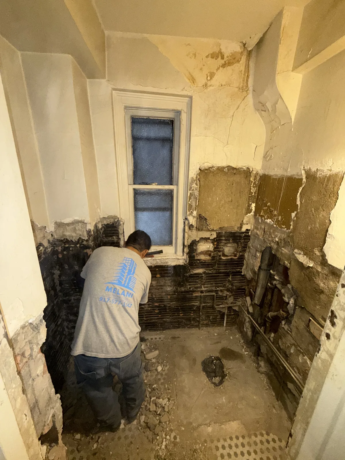Bathroom demolition stripped to lath and plaster in New York City