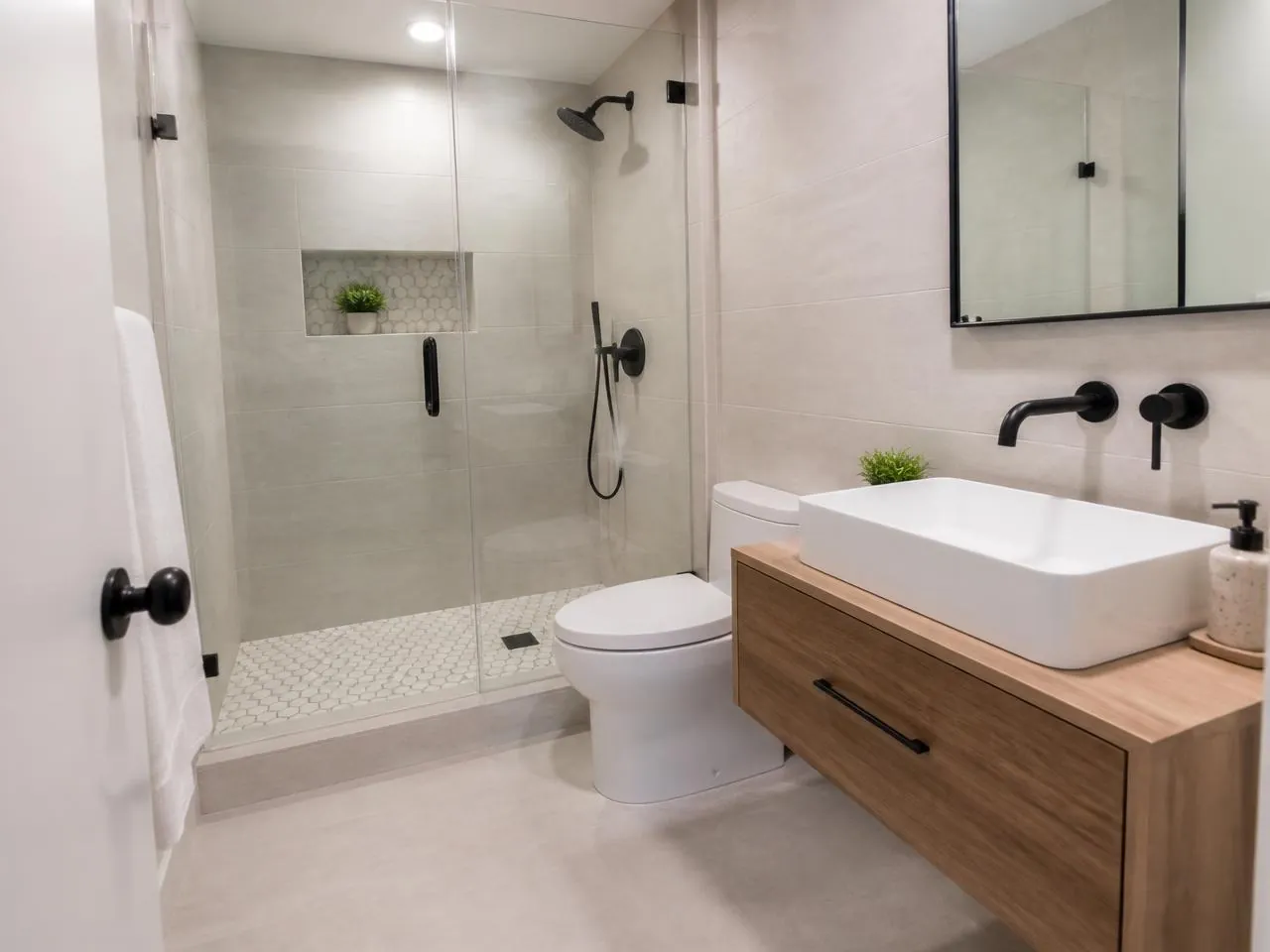 Williamsburg bathroom renovation by Melani General Contractor with glass walk-in shower and floating vanity