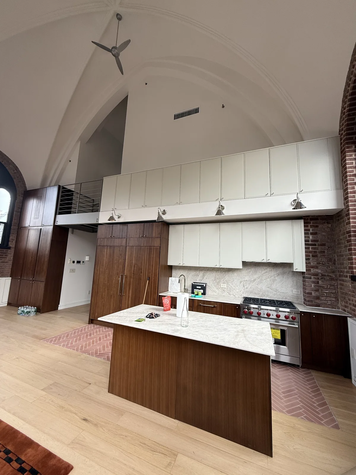 Kitchen remodeling with walnut island and marble counters in a New York City loft
