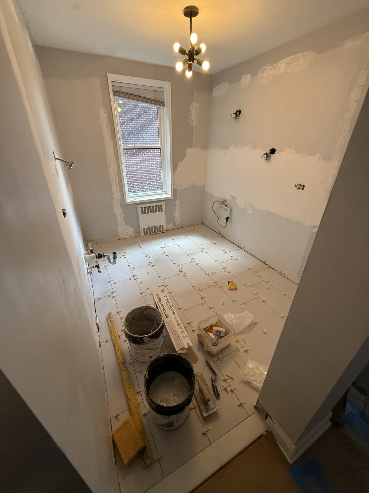 Kitchen remodeling rough-in with new floor tile in New York City
