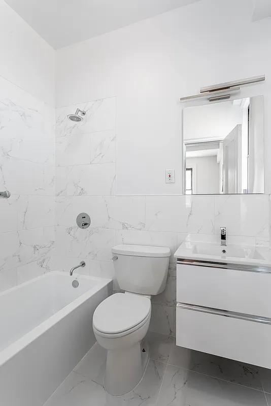 Completed marble tile bathroom renovation in New York City
