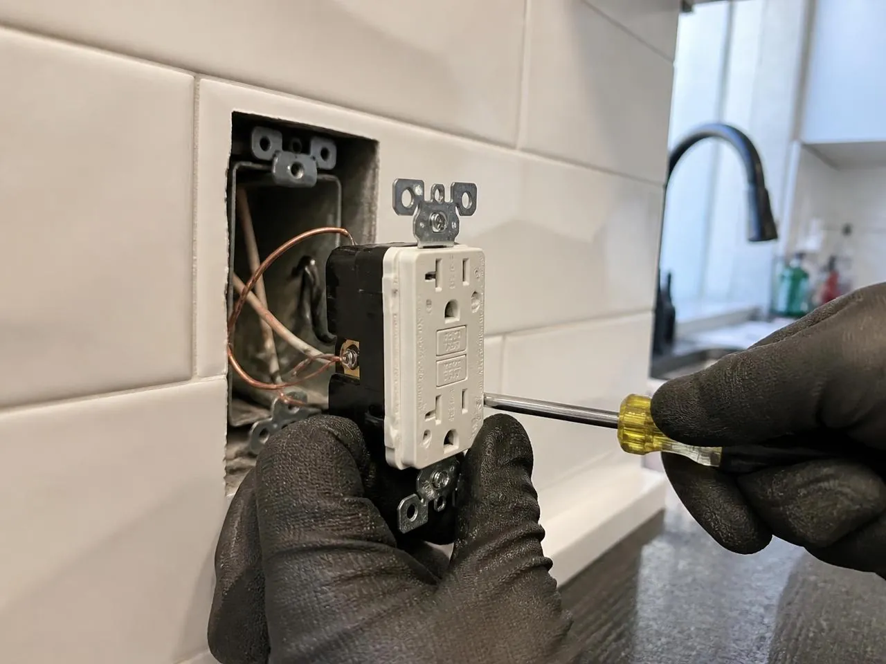 GFCI outlet installation in an NYC kitchen — electrical services NYC by Melani General Contractor