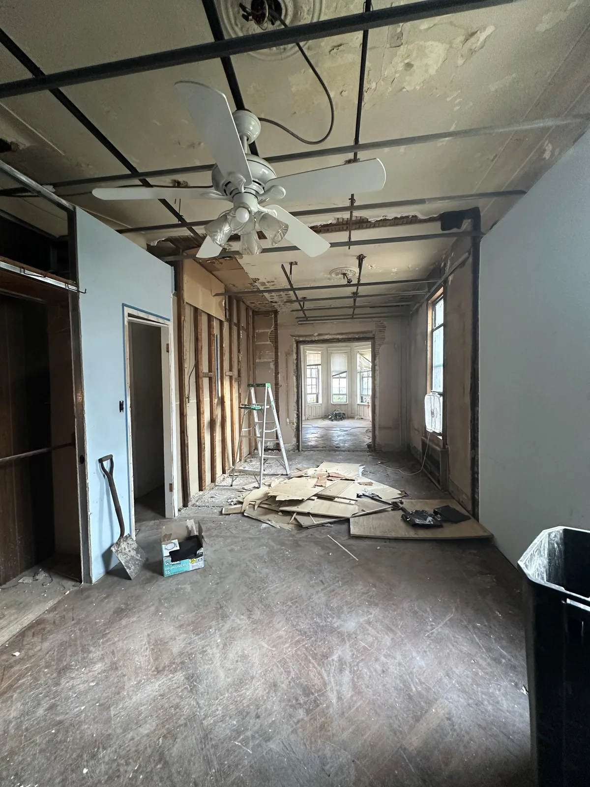 Apartment gut renovation demolition with exposed framing and ceiling in New York City