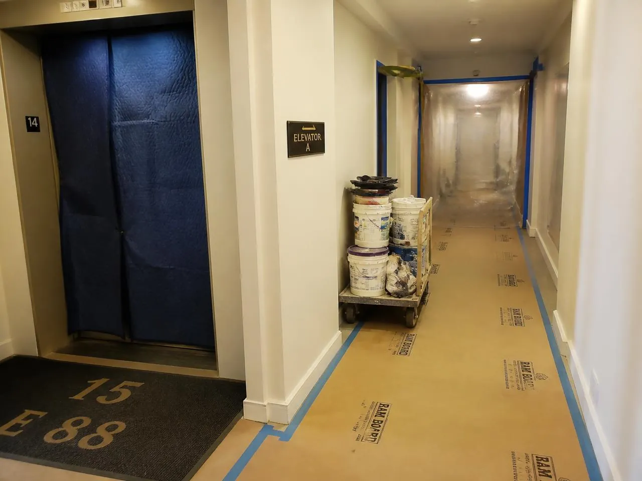 Board-approved co-op renovation NYC construction with padded elevator and protected hallway in a managed building