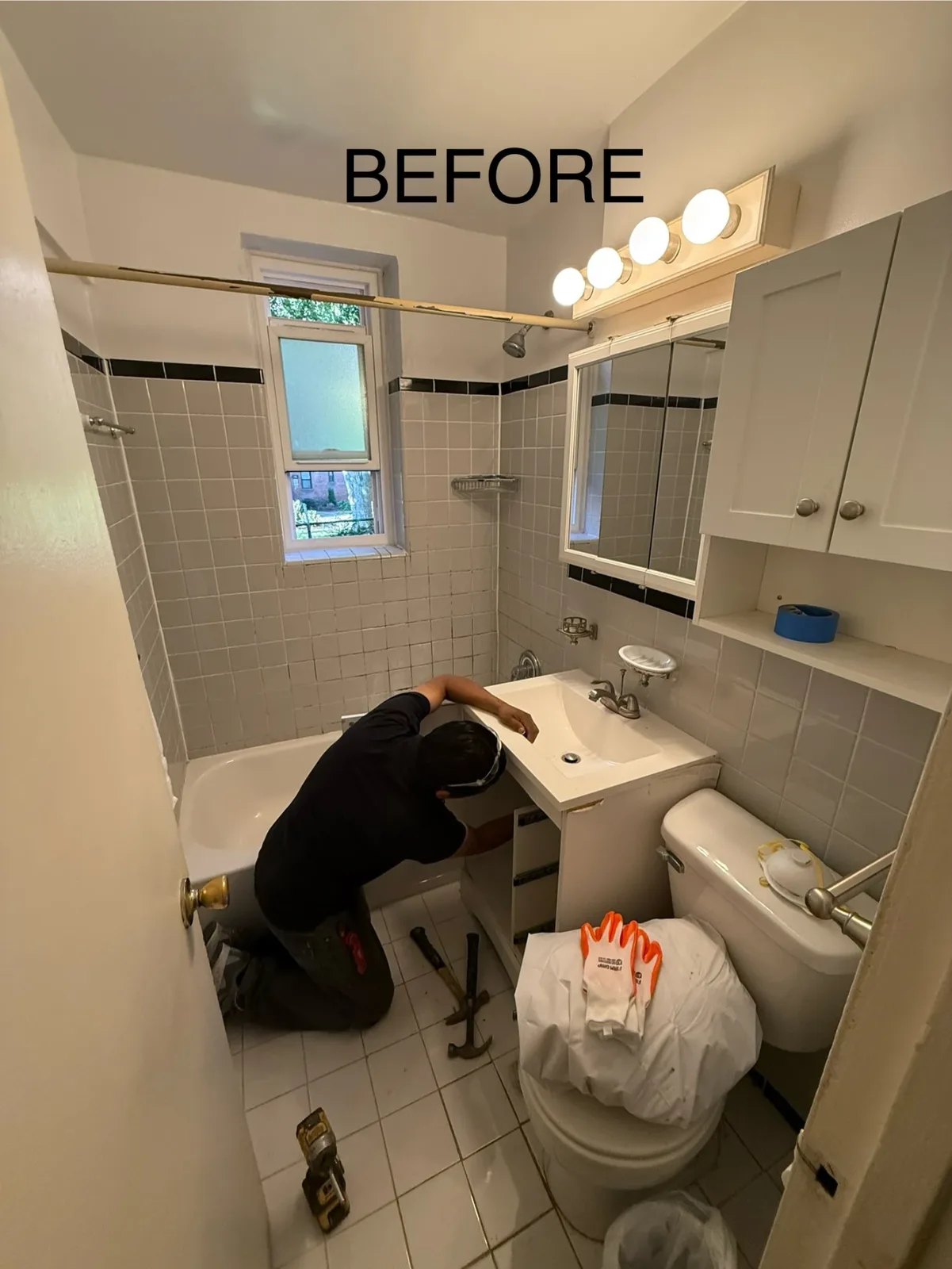 Bathroom renovation before photo showing dated tile in New York City