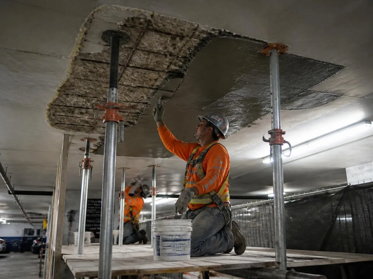 Concrete slab restoration inside an NYC parking garage under Local Law 126 requirements