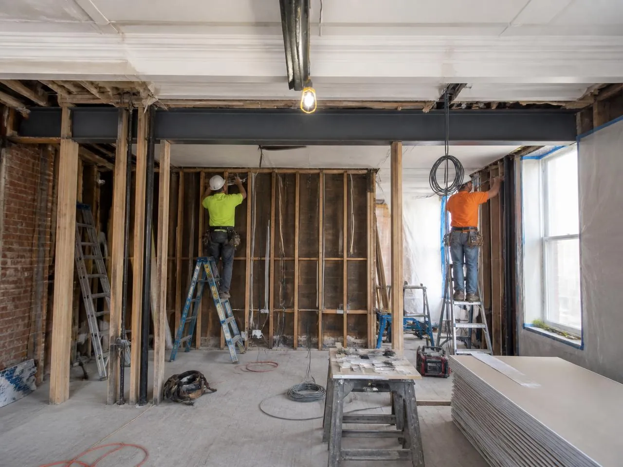 Open floor plan conversion during an apartment renovation NYC project with a steel header installed