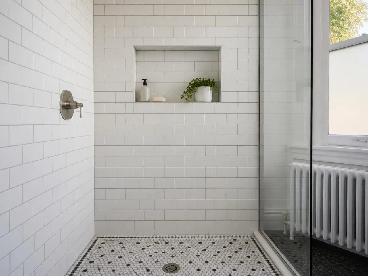 Finished subway tile shower with mosaic floor in a Brooklyn brownstone bathroom remodel